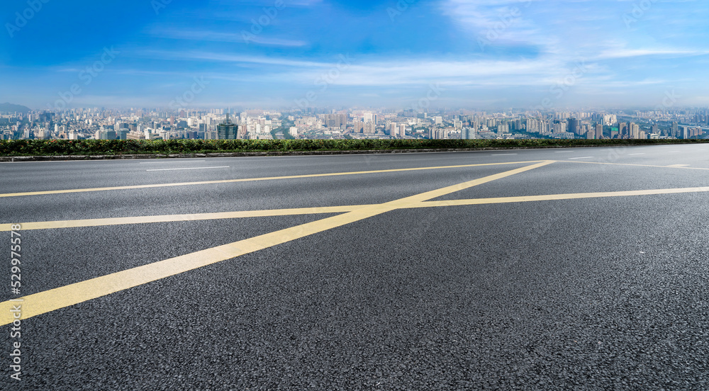 Naklejka premium Empty road and city buildings background
