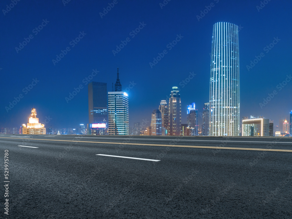Empty road and city buildings background