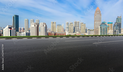 Empty road and city buildings background