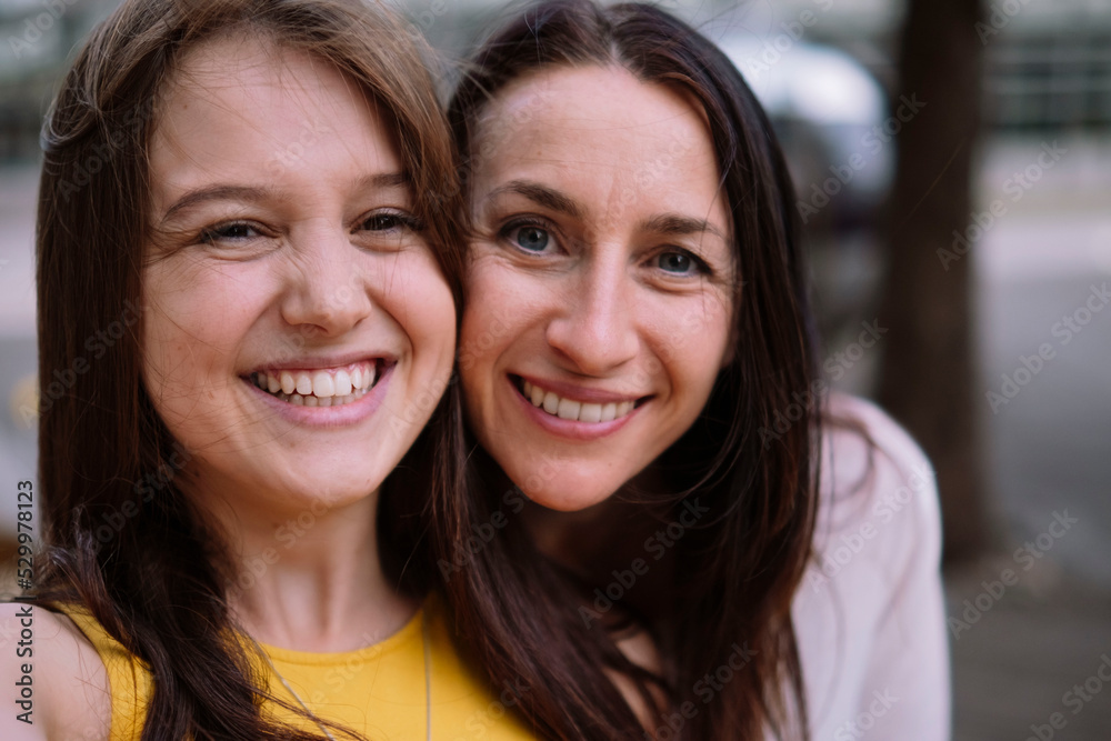 Cheerful women standing together having fun Cheerful women standing together having fun
