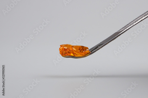 detail of resin wax of marijuana concentrate on dabbing tool