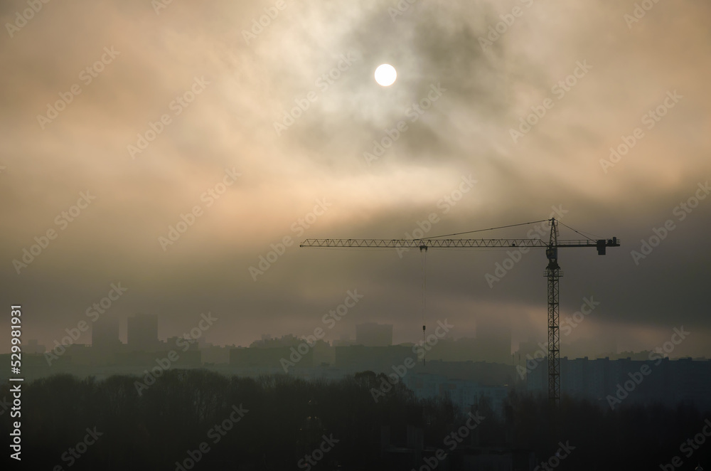 tower crane building sunset clouds sun city beautiful view