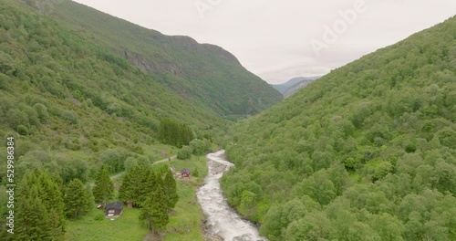 River Between Mountains Green Valley Aerial Drone Fly Above Norway Erdal Roadway photo