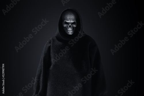 Grim reaper on dark background
