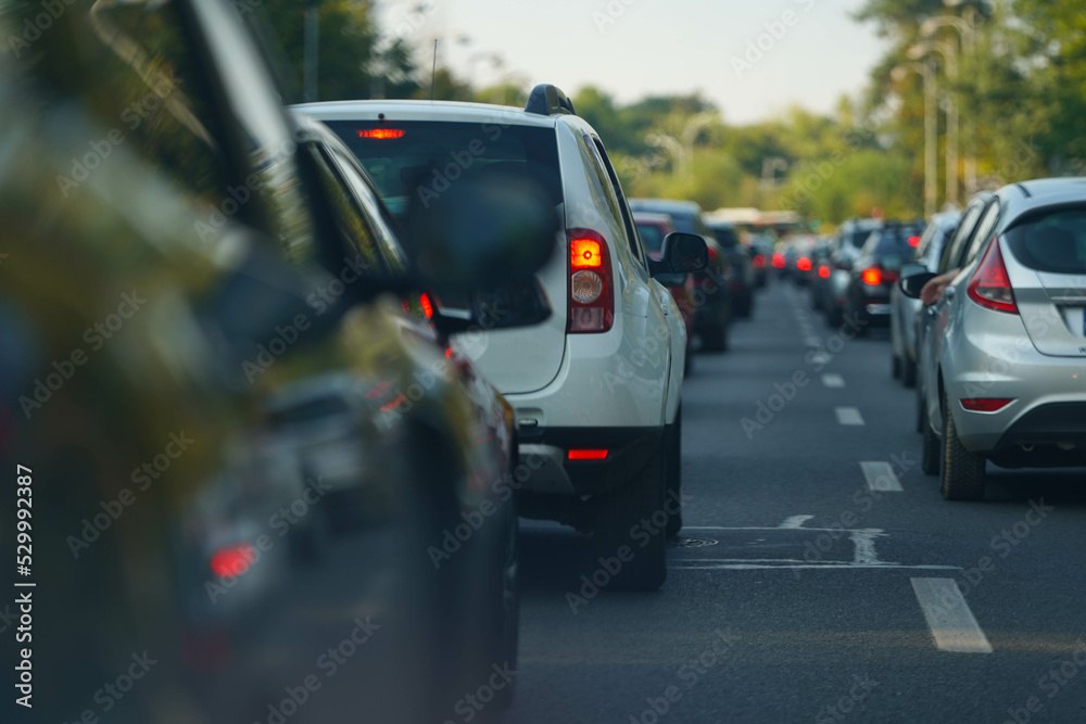 traffic. cars caught in the crowd. photo taken in the evening. people in traffic returning from work.