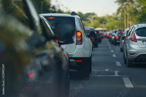 traffic. cars caught in the crowd. photo taken in the evening. people in traffic returning from work.