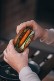 vegan burger in the hands of a man