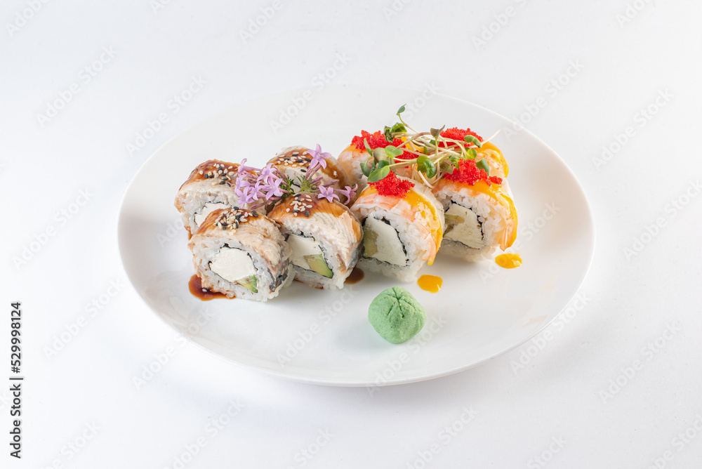 sushi on a plate with cheese and vasabi