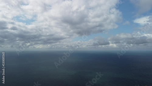Wallpaper Mural Abstract aerial nature summer ocean sunset sea and sky background. Small waves on clear water surface in motion blur with bokeh lights from sunrise. Holiday, vacation and recreational concept Torontodigital.ca