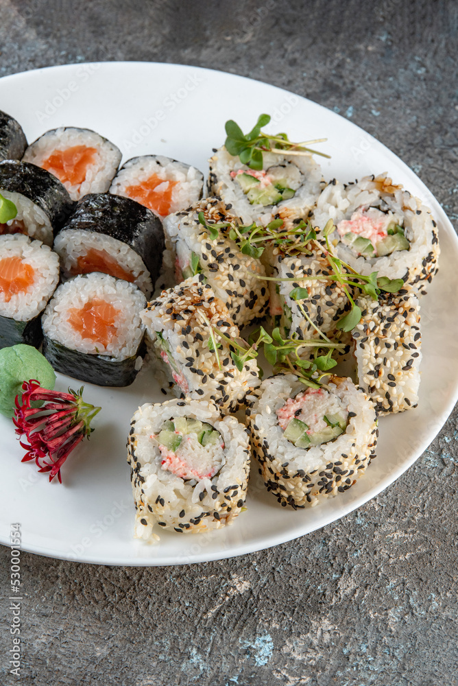 sushi on a plate with chopsticks sushi on a plate with chopsticks