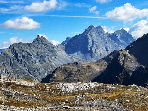 Rocky alpine peaks Unghürhörner or Unghuerhoerner (2994 m) and Vorderes Plattenhorn (3217 m) in the Silvretta Alps mountain range, Davos - Canton of Grisons, Switzerland (Kanton Graubünden, Schweiz) photo