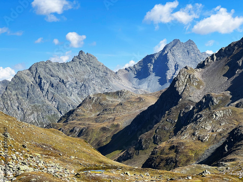 Rocky alpine peaks Unghürhörner or Unghuerhoerner (2994 m) and Vorderes Plattenhorn (3217 m) in the Silvretta Alps mountain range, Davos - Canton of Grisons, Switzerland (Kanton Graubünden, Schweiz) photo
