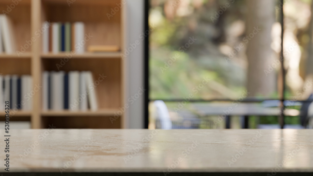Marble tabletop with empty space over blurred comfortable campus library in the background Marble tabletop with empty space over blurred comfortable campus library in the background