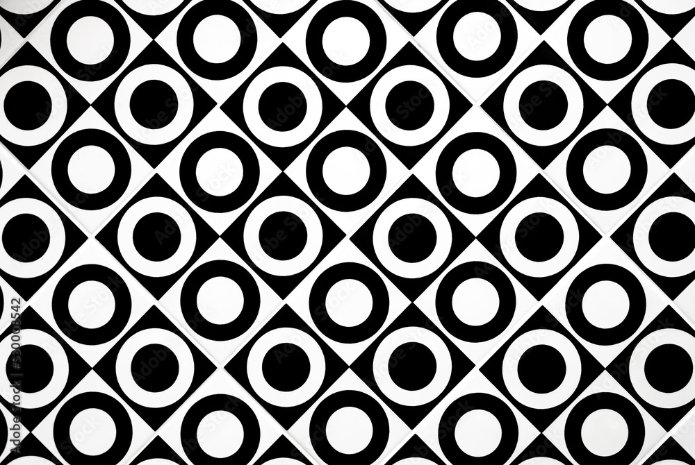 Abstract background of black and white perforated circle in rhombus pattern of modern tile wall decoration Abstract background of black and white perforated circle in rhombus pattern of modern tile wall decoration