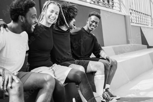 Group of young african people having fun outdoor after basketball match - Focus on right guy face - Black and white editing