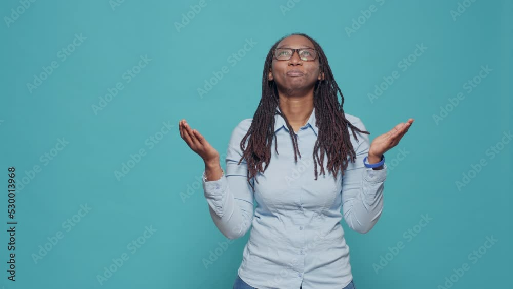 Female person begging for good luck and fortune, asking god for desire and wish. Praying and hoping for request, doing prayer hands in front of studio camera. Dreaming and waiting in anticipation. Female person begging for good luck and fortune, asking god for desire and wish. Praying and hoping for request, doing prayer hands in front of studio camera. Dreaming and waiting in anticipation.