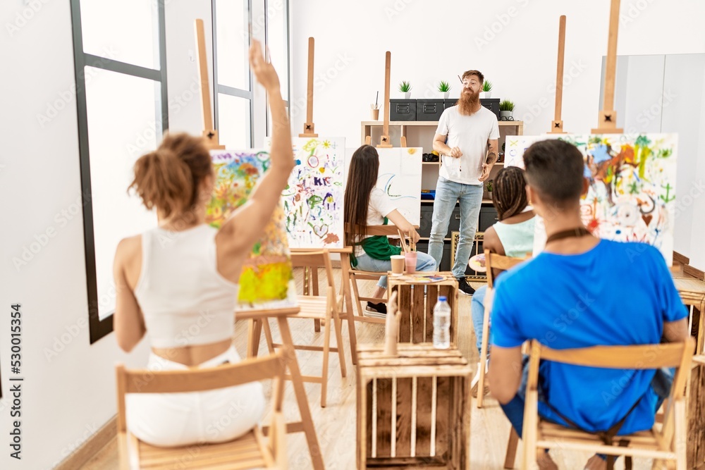Group of people smiling happy drawing in paint class at art studio. Group of people smiling happy drawing in paint class at art studio.
