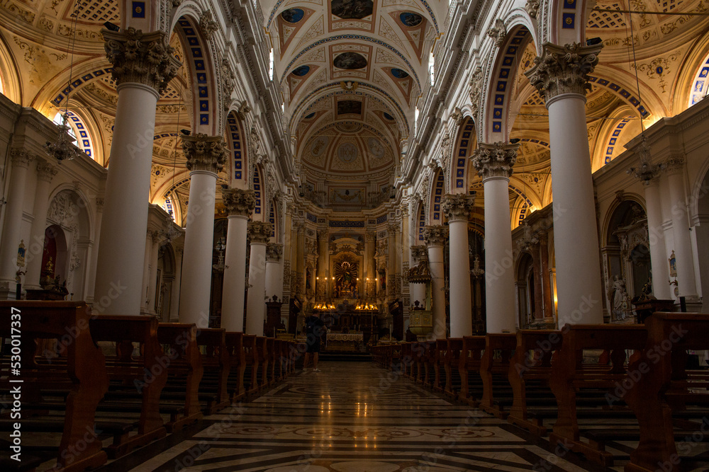Obraz premium Internal naves of the basilica of San Pietro, a religious building in Modica, in the province of Ragusa, Italy. This church is considered a masterpiece of the Italian Baroque.