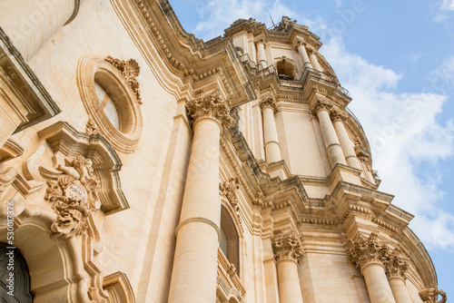 Closeup of the bell tower of the Duomo di San Giorgio, the mother church of the city of Modica in Sicily, Italy. photo