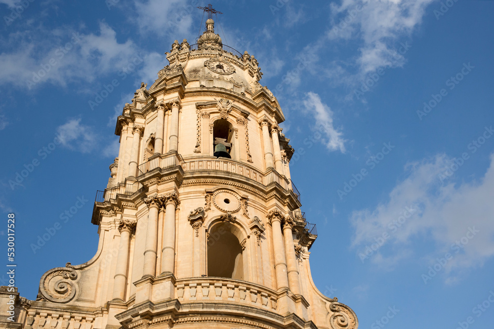 Closeup of the bell tower of the Duomo di San Giorgio, the mother church of the city of Modica in Sicily, Italy.