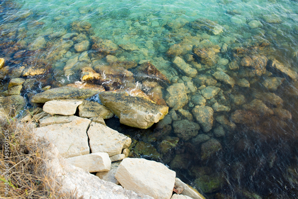 Rocks in the blue sea of ​​Sicily, Italy.