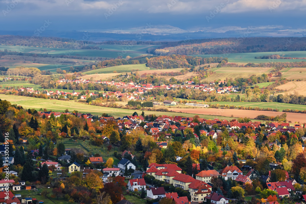 Houses and river in the city of Bleicherode, Germany. View from the top of german little city in autumn day.