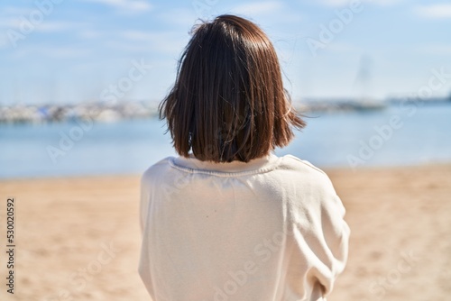 Middle age woman standing at seaside
