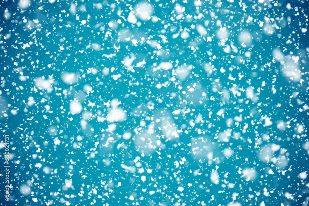 Sparkling snowflakes falling from turquoise sky. Sparkling snowflakes falling from turquoise sky.