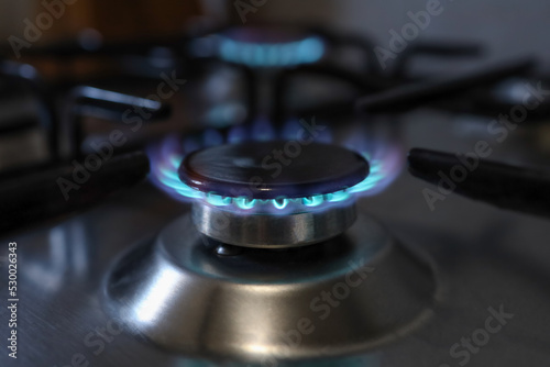 Close-up of a flame of methane gas stove in a domestic kitchen