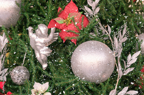 Close up of big silebr balls on Christmas tree with show and decoration. Nerry Christmas and happyt New year greeting card. photo