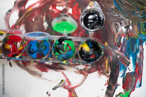 Hand painting from color containers, mixed colors 