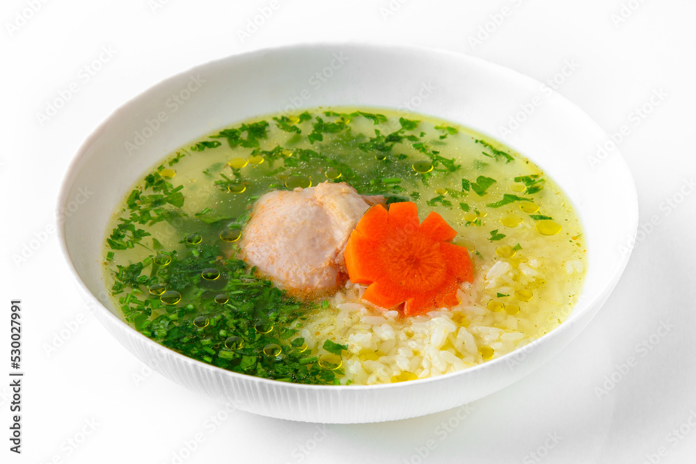 Fragrant first course from chicken broth, rice and poultry meat with herbs. Dietary cream soup based on baked and fresh vegetables with herbs. Fitness menu. Delivery of prepared food. 