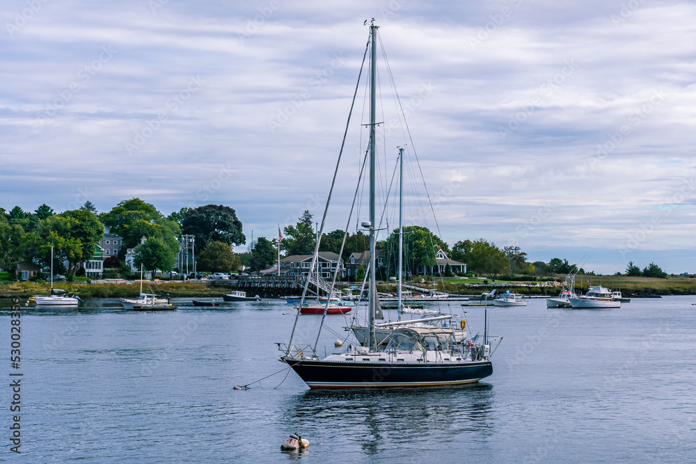 Marine yacht with a black hull parked on the river