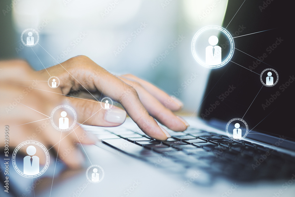 Double exposure of social network icons concept with hand typing on computer keyboard on background. Networking concept Double exposure of social network icons concept with hand typing on computer keyboard on background. Networking concept