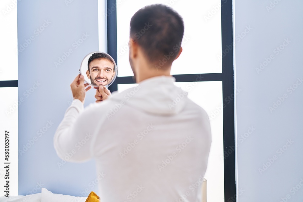 Obraz premium Young hispanic man lying on bed sleeping at home