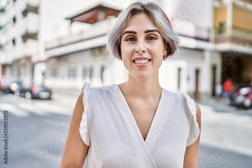 Young caucasian girl smiling happy standing at the city. © Krakenimages.com