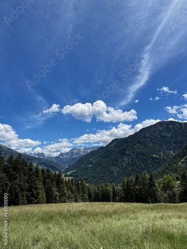 Scenic view of mountains, valley, forest, sky with clouds. Landscape