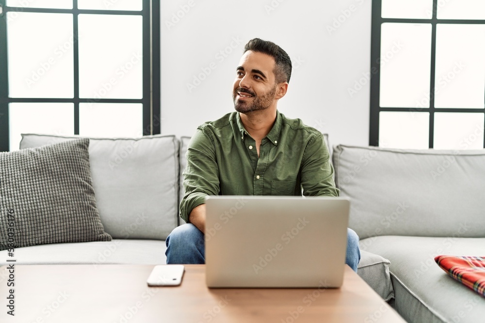 Young hispanic man smiling confident using laptop at home Young hispanic man smiling confident using laptop at home