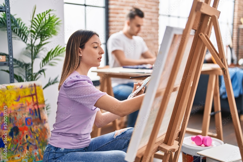Man and woman artists couple drawing at art studio Man and woman artists couple drawing at art studio