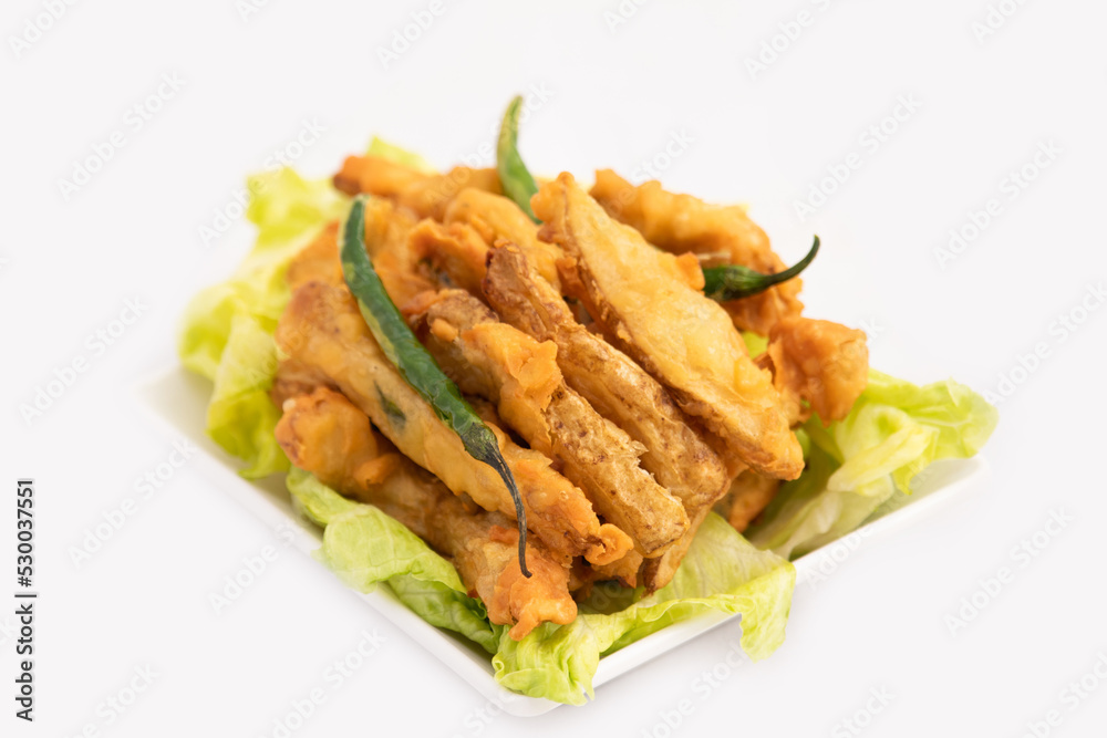 Indian Street Food Sliced Crispy Fried Potato Wedges Also Called Aloo Bhajji, Alu Bajji, Aaloo Pakoda or Pakora Made Of Bengal Gram Flour Besan Coating Are Famous Tea Time Evening Time Appetizer Indian Street Food Sliced Crispy Fried Potato Wedges Also Called Aloo Bhajji, Alu Bajji, Aaloo Pakoda or Pakora Made Of Bengal Gram Flour Besan Coating Are Famous Tea Time Evening Time Appetizer