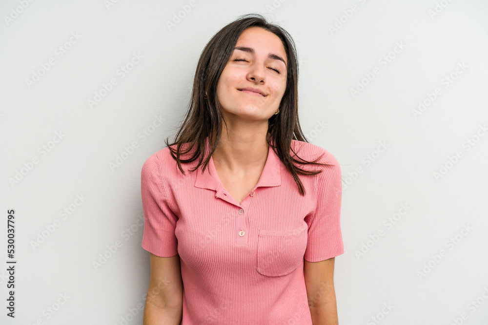 Young caucasian woman isolated on white background laughs and closes eyes, feels relaxed and happy. Young caucasian woman isolated on white background laughs and closes eyes, feels relaxed and happy.