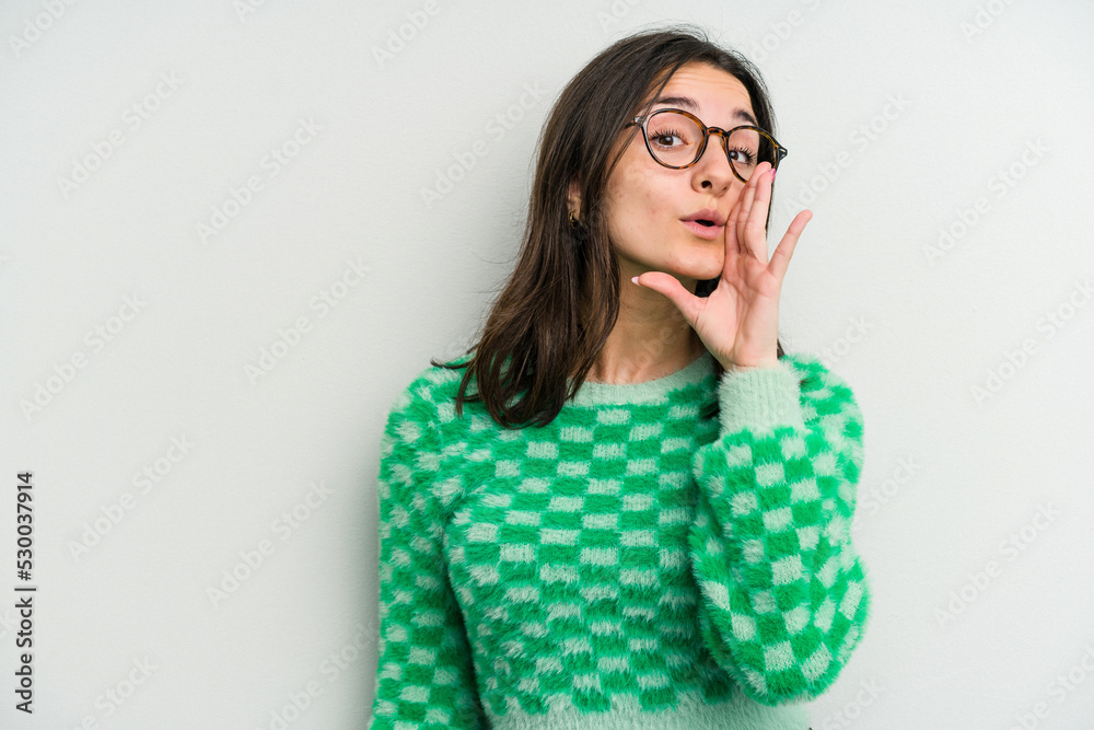Young caucasian woman isolated on white background is saying a secret hot braking news and looking aside Young caucasian woman isolated on white background is saying a secret hot braking news and looking aside