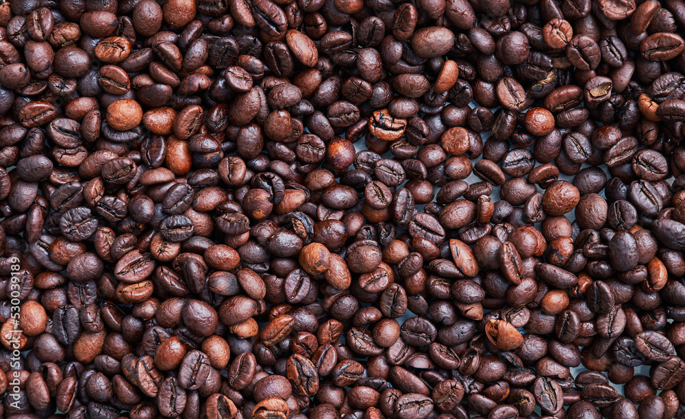 Brown and black coffee beans. Roasted arabic espresso coffee grains. Brown and black coffee beans. Roasted arabic espresso coffee grains.