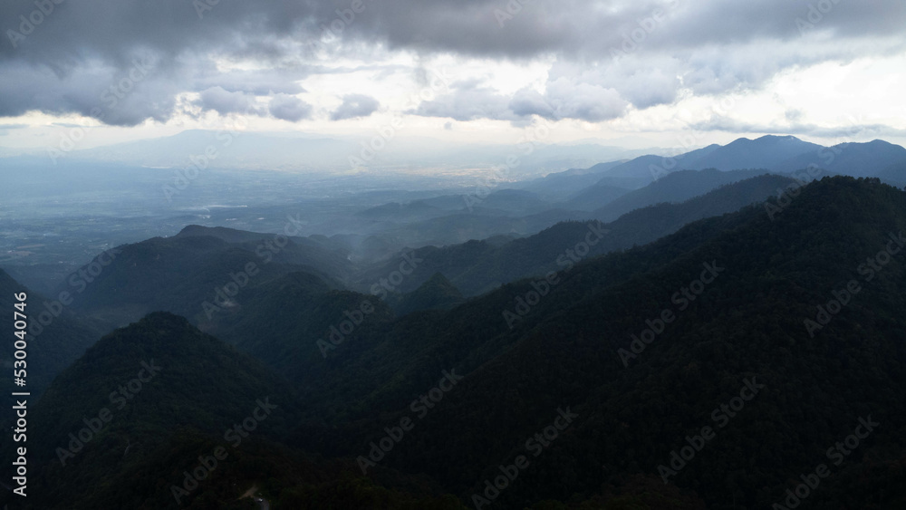 Aerial view of sea of fog on tropical mountains in the early morning.