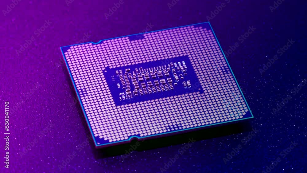 Computer CPU chip rotating - close up video. Shallow field of view. Macro shot of technology background. Computer CPU chip rotating - close up video. Shallow field of view. Macro shot of technology background.