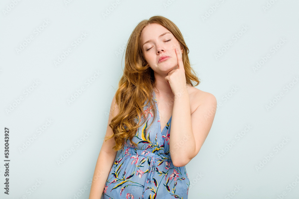 Young caucasian woman isolated on blue background crying, unhappy with something, agony and confusion concept. Young caucasian woman isolated on blue background crying, unhappy with something, agony and confusion concept.