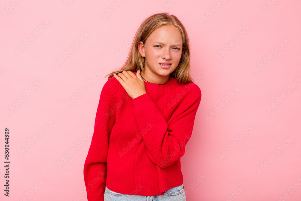 Caucasian teen girl isolated on pink background having a shoulder pain. Caucasian teen girl isolated on pink background having a shoulder pain.