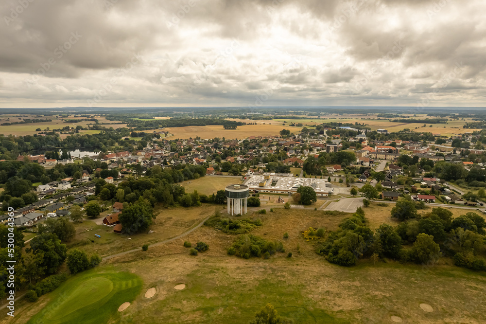 Sweden, Knislinge – September 10, 2022: Aerial view of a little village, golf course, green field