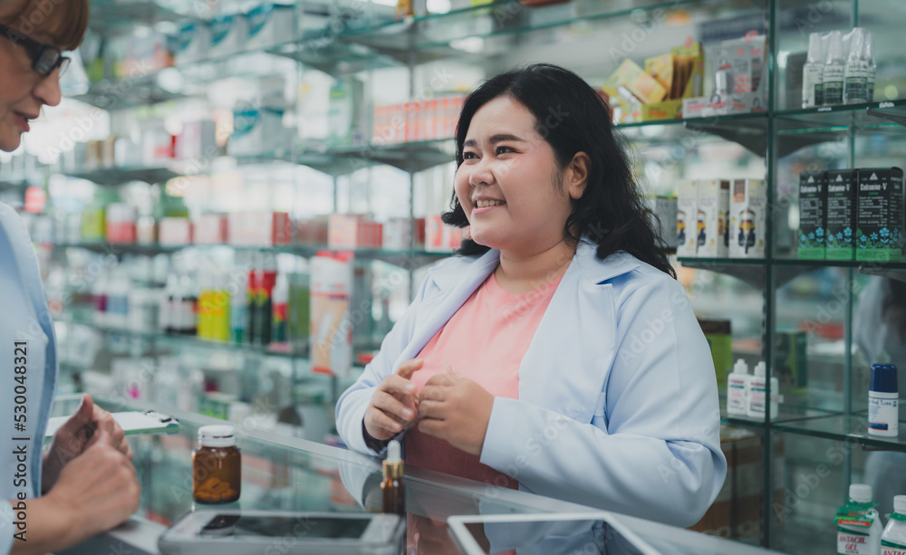 female pharmacist assistant,Pharmacists provide drug advice to customers.Professional seller medicamen.female doctor healt care of pharmacy customer 