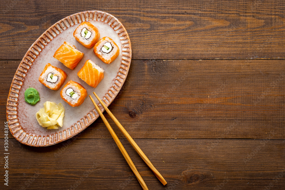 Sushi roll set with salmon and cream cheese on plate. Japanese food